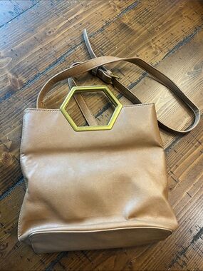 Tan Leather Crossbody Bag with Gold Hexagon Accent.